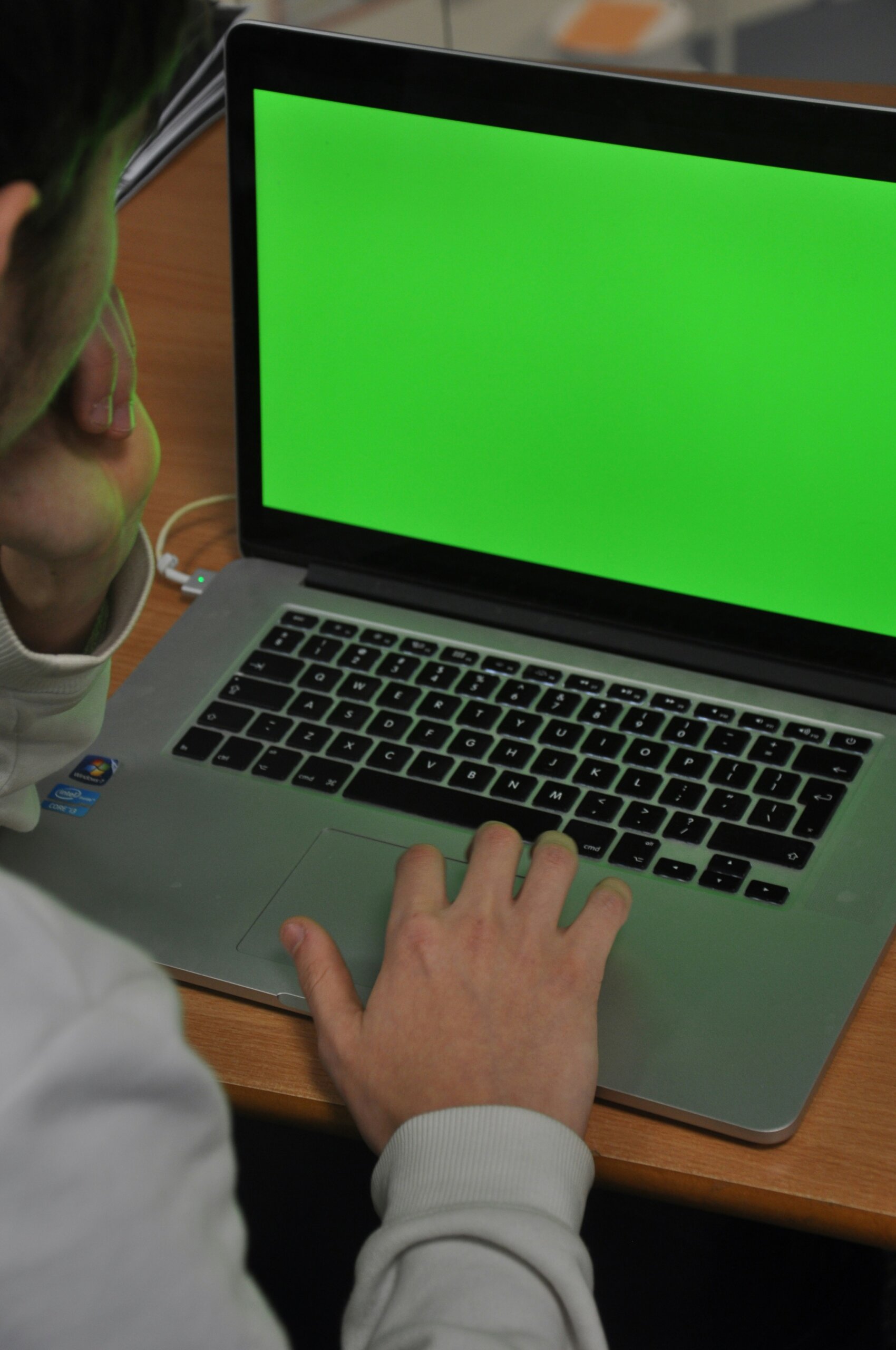 A person using a laptop for an online psychiatry appointment